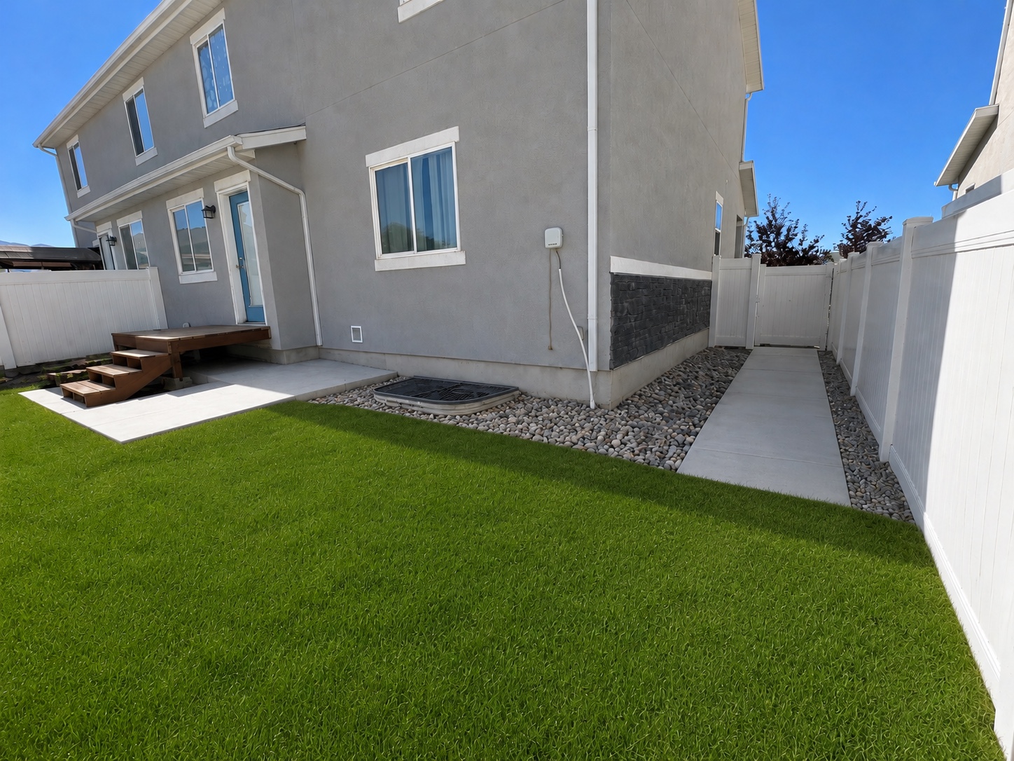 Freshly maintained yard and exterior after landscaping and pressure washing